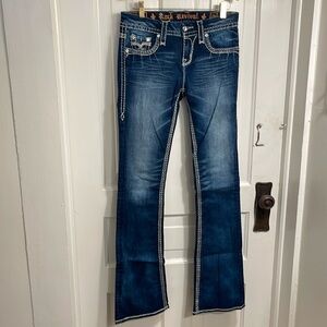 Rock Revival low rise women’s blue jeans.